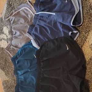 Lot of four Nike running shorts